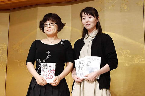 Natsuko Imamura and Masumi Oshima win the Akutagawa and Naoki Prizes. Since 1935, the prizes have recognised fiction, awarding 1 million yen and a path for translations. (Kyodo News via AP)