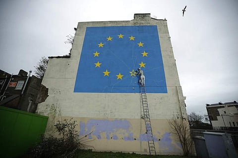 A mural by Banksy, depicting a star being chiselled from the European flag, in Dover, south east England (AP Photo/Matt Dunham)