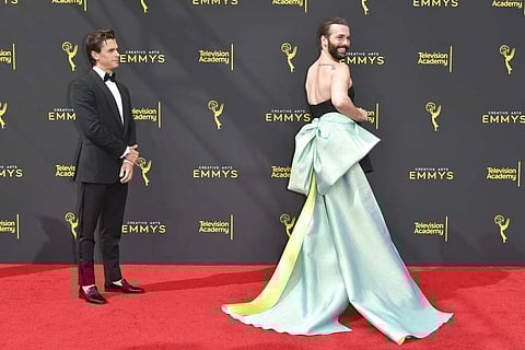 Antoni Porowski, left, and Jonathan Van Ness, cast members from 'Queer Eye,' arrive at night one of the Creative Arts Emmy Awards on Saturday