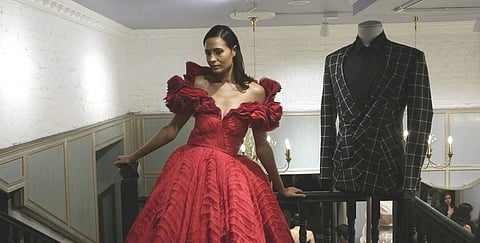 A voluminous textured tulle gown in deep scarlet by Gaurav Gupta