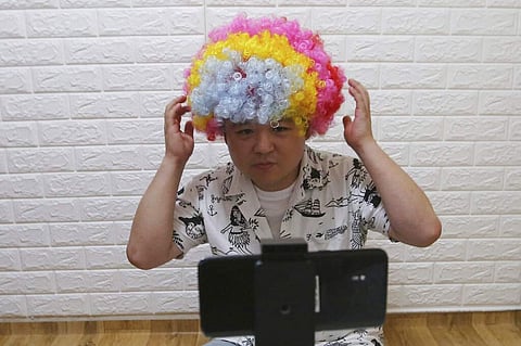 Jang Myung-jin films for a broadcast in Seoul. His is one of many new YouTube channels offering rare glimpses of life in one of the world’s most repressive countries. (AP Photo/Ahn Young-joon)