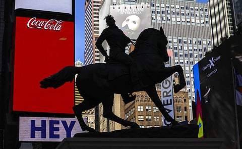 A bronze sculpture, 'Rumors of War' by artist Kehinde Wiley, at Times Square in New York, depicts a young African American in urban streetwear astride a horse. Until Dec 1. (AP Photo/Bebeto Matthews)