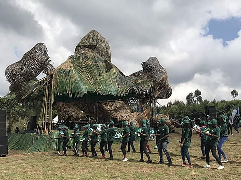 The massive gathering at the base of Volcanoes National Park wore a festive air with locals waving flags, dancing and chanting. And, the numbers are growing each year! (All pics by Red Scarab)