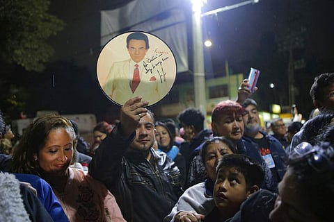 Fans gather to sing and remember Jose Jose to mourn his death at José José's statue in Mexico City. Mexican crooner José José, known as the 'Prince of Song,' died at age 71. (AP Photo/Anthony Vazquez)