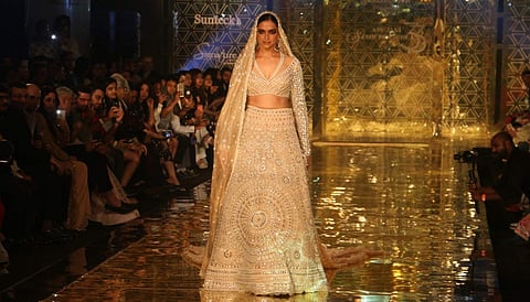 Deepika walked down the ramp for the designers' label donning an ivory embellished lehenga, and enthralling the spectators with an ethnic look.