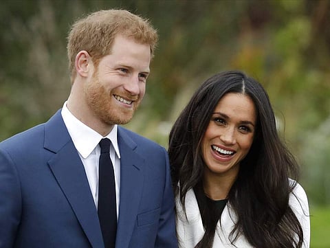 Britain's Prince Harry and his wife Meghan (AP Photo/Matt Dunham, File)