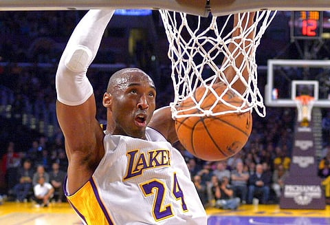 Jan 4, 2015: Kobe Bryant dunks at a game in LA (AP Photo/Mark J. Terrill)