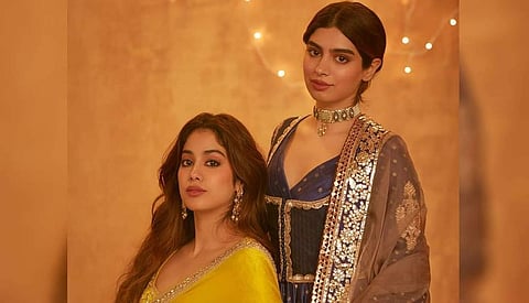 Janhvi in a yellow saree with traditional intricate zari embroidery and Khushi in a silk inspired peshwaz with a quilted sadri jacket and a trailing gharara, both by Manish Malhotra