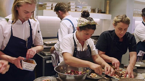 Analiese Gregory (centre) busy cooking during the AO Chef Series