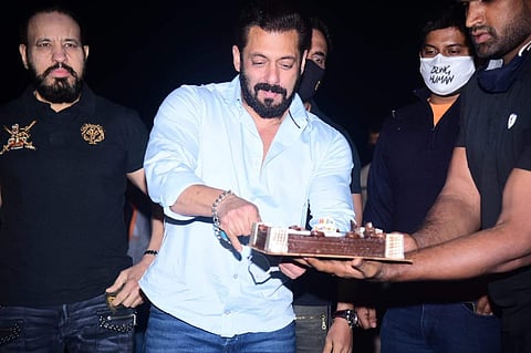 Salman Khan ushered in his birthday by cutting a cake at his Panvel farm house on Saturday night