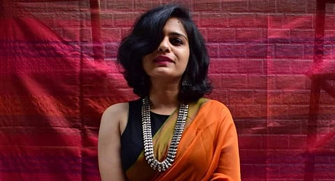 A solid orange hand-woven sari by Bunavat