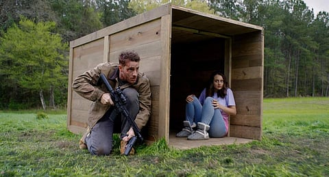 Justin Hartley and Sylvia Grace Crim in The Hunt (Universal Pictures via AP)