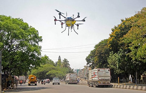 Drones deployed by the Bengaluru civic body spray disinfectants across the city during the complete lockdown imposed across the country to contain the spread of the coronavirus. (Photo: IANS)
