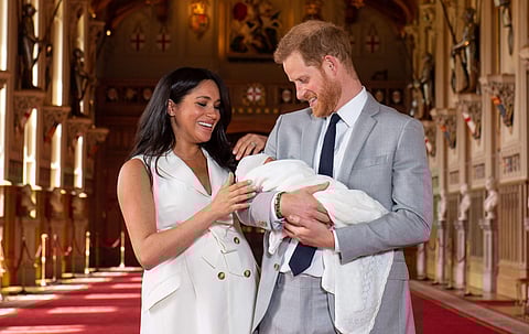 Britan's Prince Harry and his wife Meghan Markle with their son, Archie