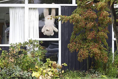 A teddy bear in a house in Christchurch (AP Photo/Mark Baker)