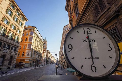 Via Nazionale, one of the busiest roads of Rome's city centre, stands empty at 1800 on Friday, April 24, 2020. (AP Photo/Andrew Medichini)