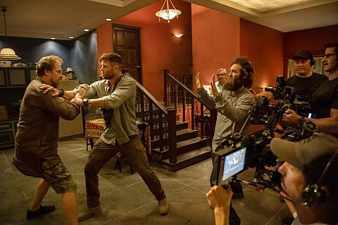 Sam Hargrave directs David Harbour and Chris Hemsworth in Extraction (Jasin Boland/Netflix via AP)