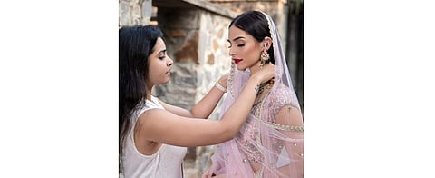 Designer Keerthi Kadire with a model