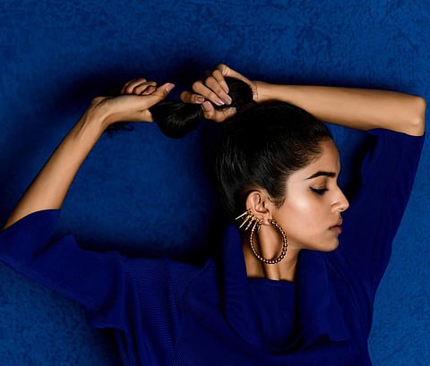 Statement earrings by Ridhi Asrani