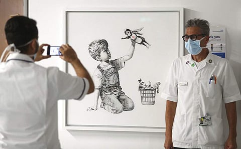 The new artwork by Banksy titled Game Changer (Andrew Matthews/PA via AP)