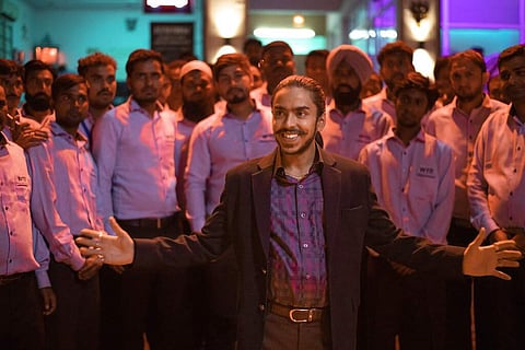 A still from The White Tiger featuring Adarsh Gourav