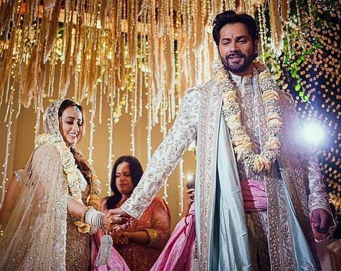 Varun Dhawan shared the first pictures from his wedding to his childhood sweetheart Natasha Dalal with the caption: “Life long love just became official ❤” Courtesy: Instagram/Varun Dhawan