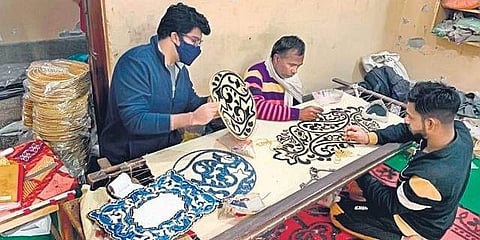 A beading craftsperson at work