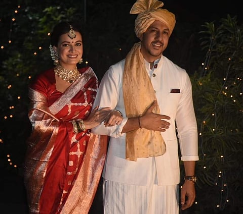 Dia and Vaibhav pose for the paparazzi after the wedding
