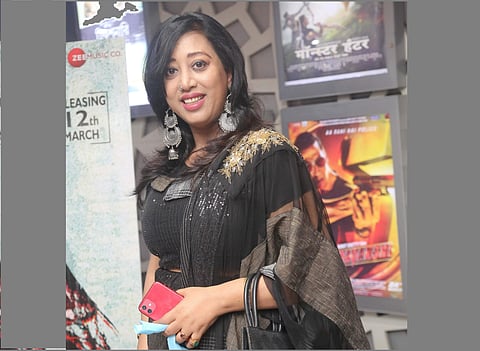 Director Reshmi Mitra looks graceful in a black sari at the premiere