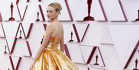 Carey stuns in a two-piece Valentino gown