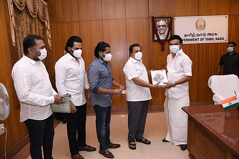 Suriya, Karthi, Sivakumar hand over cheque of Rs 1 crore to MK Stalin