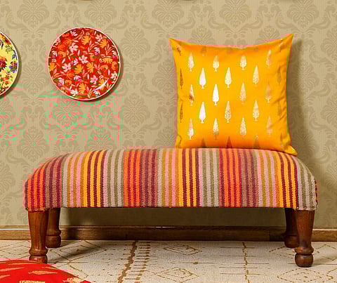 Throw in bright cushions to add some colour to your space