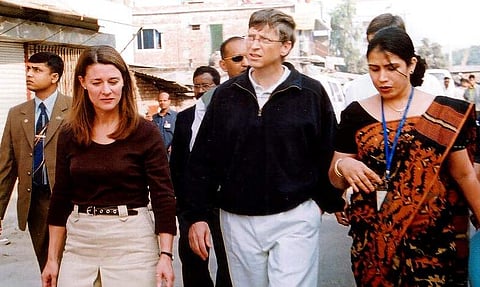 Melinda Gates and Bill Gates walking on a street in Dhaka, Bangladesh. (2005 File Photo, Courtesy: AP)