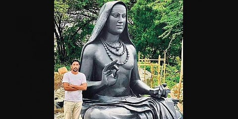 Sculptor Arun Yogiraj stands beside the statue of Adi Shankaracharya. (Photo| EPS)