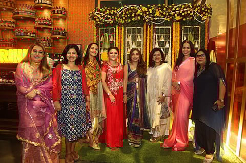 The gorgeous hosts with a bunch of city's trendsetters