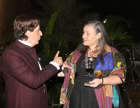 French consul general Didier and US consul general Melinda converse over glasses of wine