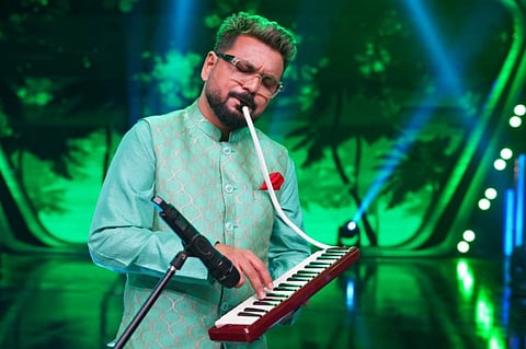 Rathijit plays a melodica