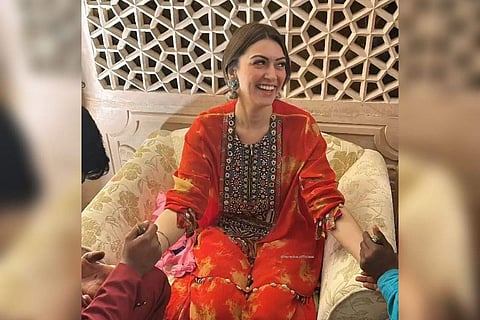 Hansika can be seen donning a red outfit in the photographs while Sohail went for a peach and cream outfit