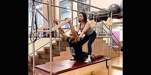 Pilates’ instructor Kavita Prakash with a client