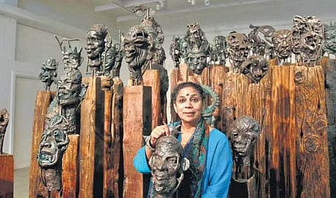 Artist Nivedita Mishra with her artwork showcasing 64 Yoginis (Photo | EPS, Shekhar Yadav)