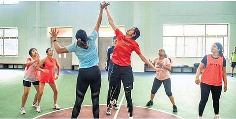 Members of Sisters in Sweat during a practice session of football and basketball