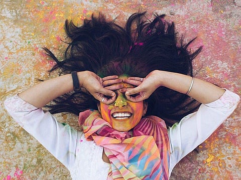 A multi-coloured scarf paired with an easy-breezy cotton top