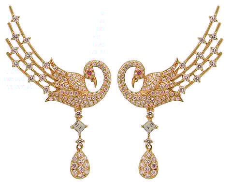 A pair of earrings by CKC