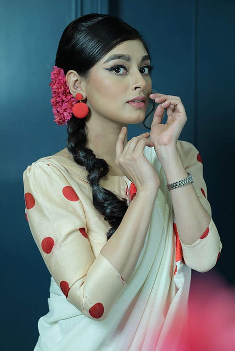 A simple cotton floral sari and polka-dotted puff sleeve blouse by Parama Ghosh