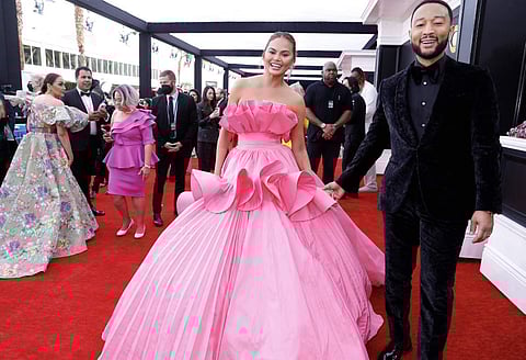 John Legend and Chrissy Teigen walked in hand in hand