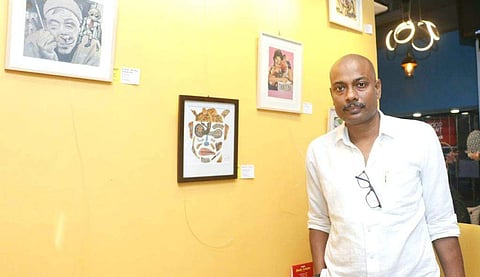 Dyutiman Bhattacharya with his artworks