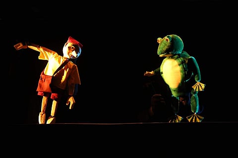 Pinocchio's tale being narrated through puppetry