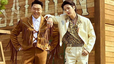 K-Pop stars PSY and Suga from BTS