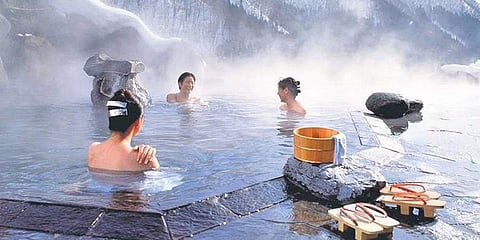 People enjoying a warm bath in one of the many onsens in Japan
