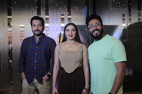 Lead actors Subhashree and Parambrata with filmmaker Raj Chakraborty